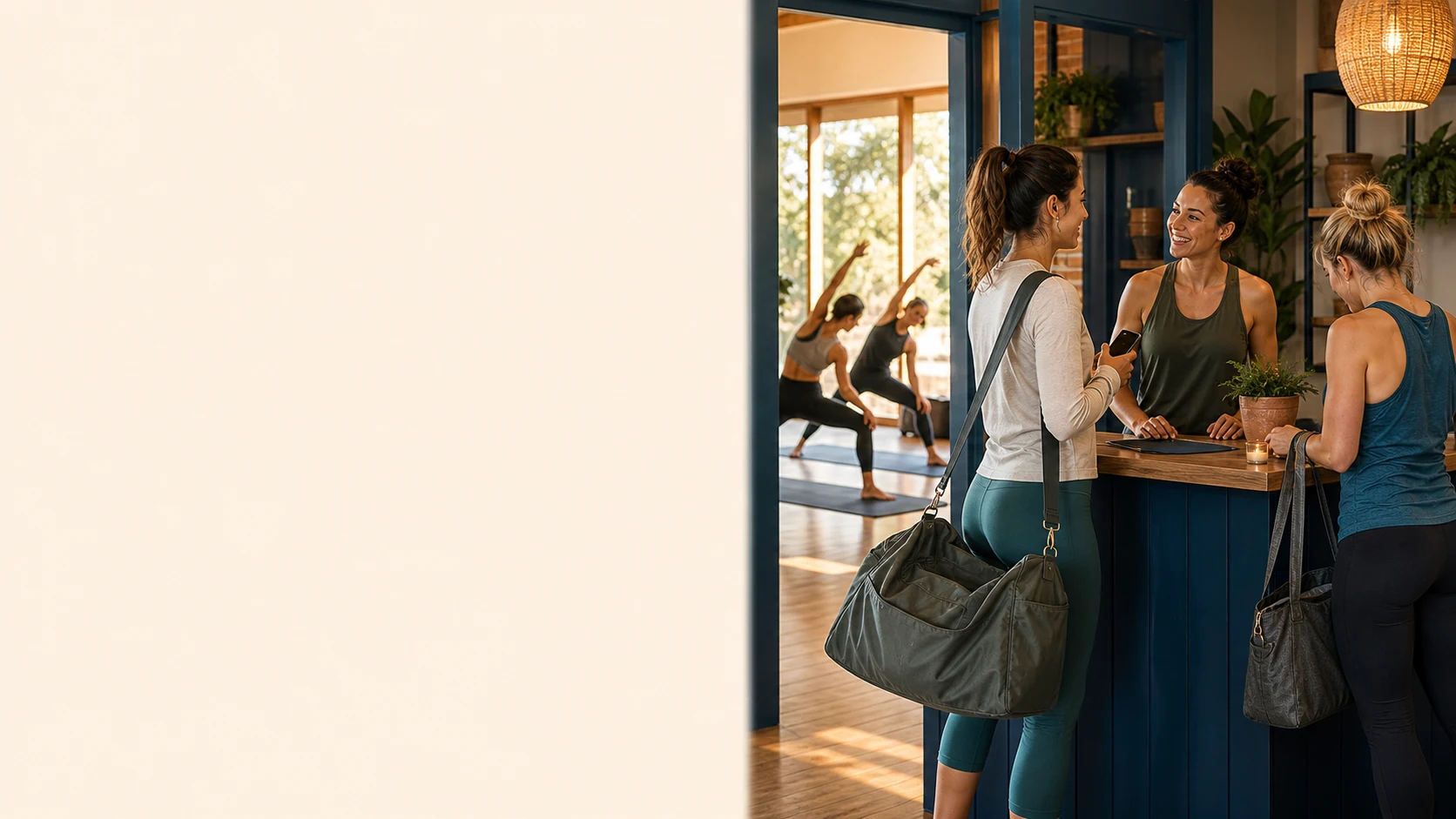 A fitness studio owner welcoming first-time visitors with class schedule and booking cues nearby